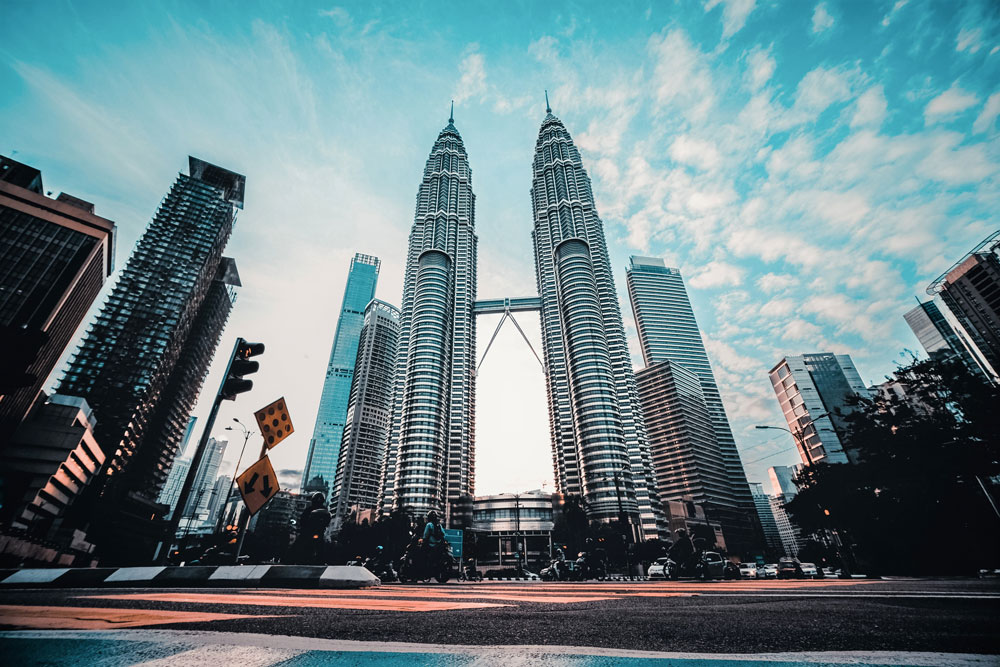 low-angle-view-buildings-against-cloudy-sky